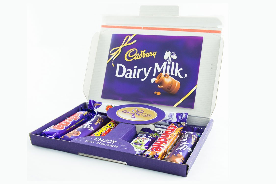 Cadbury selection box postal letter box sized packaging Cadbury postal letterbox sized chocolate packaging deliveries for ecommerce Cadbury selection box letter postal packaging